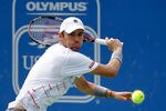 NORCROSS, GA - JULY 24:  Mardy Fish plays a backhand during the singles final against John Isner at the Atlanta Tennis Championships at the Racquet Club of the South on July 24, 2011 in Norcross, Georgia.  (Photo by Mike Ehrmann/Getty Images)
