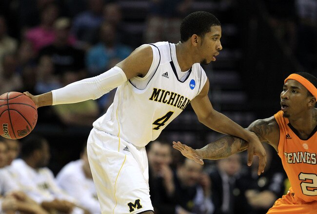 CHARLOTTE, NC - MARCH 18:  Darius Morris #4 of the Michigan Wolverines moves the ball against Melvin Goins #2 of the Tennessee Volunteers in the second half during the second round of the 2011 NCAA men's basketball tournament at Time Warner Cable Arena on March 18, 2011 in Charlotte, North Carolina.  (Photo by Streeter Lecka/Getty Images)