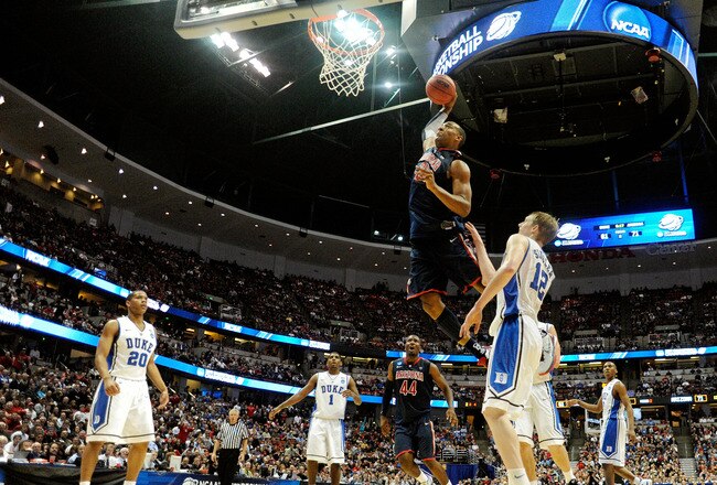 ANAHEIM, CA - MARCH 24:  Derrick Williams #23 of the Arizona Wildcats dunks the over Kyle Singler #12 of the Duke Blue Devils during the west regional semifinal of the 2011 NCAA men's basketball tournament at the Honda Center on March 24, 2011 in Anaheim, California.  (Photo by Kevork Djansezian/Getty Images)