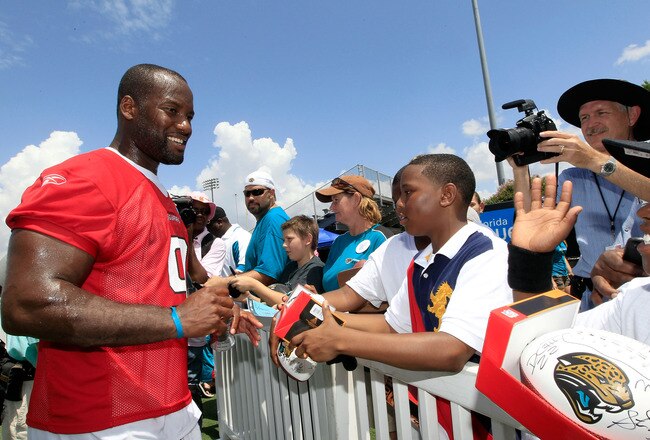 JACKSONVILLE, FL - JULY 28:  Quarterback David Garrard #9 of the Jacksonville Jaguars signs autographs following training camp at Florida Blue Health and Wellness practice fields on July 28, 2011 in Jacksonville, Florida.  (Photo by Sam Greenwood/Getty Images)