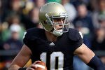 SOUTH BEND, IN - OCTOBER 30: Dayne Crist #10 of the Notre Dame Fighting Irish looks for a receiver against the Tulsa Golden Hurricane at Notre Dame Stadium on October 30, 2010 in South Bend, Indiana. Tulsa defeated Notre Dame 28-27. (Photo by Jonathan Daniel/Getty Images)