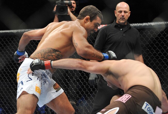 DALLAS - SEPTEMBER 19:  UFC fighter Vitor Belfort  (L) battles UFC fighter Rich Franklin (R) during their Catch weight bout at UFC 103: Franklin vs. Belfort at the American Airlines Center on September 19, 2009 in Dallas, Texas.  (Photo by Jon Kopaloff/Getty Images)