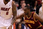 MIAMI, FL - JANUARY 31: LeBron James #6 of the Miami Heat posts up Christian Eyenga #8 of the Cleveland Cavaliers during a game at American Airlines Arena on January 31, 2011 in Miami, Florida. NOTE TO USER: User expressly acknowledges and agrees that, by downloading and/or using this Photograph, User is consenting to the terms and conditions of the Getty Images License Agreement.  (Photo by Mike Ehrmann/Getty Images)