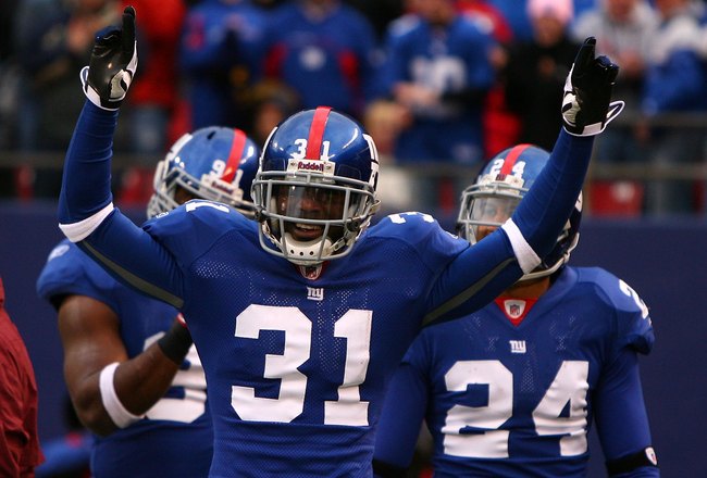 EAST RUTHERFORD, NJ - NOVEMBER 16:  Aaron Ross #31 of the New York Giants celebrates after returning an interception for a touchdown against  the Baltimore Ravens in the fourth quarter of  their game on November 16, 2008 at Giants Stadium in East Rutherford, New Jersey.  (Photo by Al Bello/Getty Images)