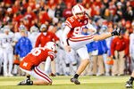LINCOLN, NE - NOVEMBER 13: Alex Henery #90 of the Nebraska Cornhuskers kicks an extra point against the Kansas Jayhawks during their game at Memorial Stadium on November 13, 2010 in Lincoln, Nebraska. Nebraska Defeated Kansas 20-3. (Photo by Eric Francis/Getty Images)