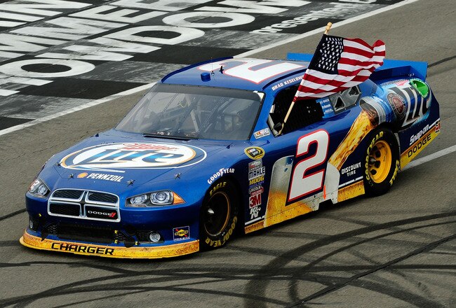 LONG POND, PA - AUGUST 07:  Brad Keselowski, driver of the #2 Miller Lite Dodge, celebrates after winning the NASCAR Sprint Cup Series Good Sam RV Insurance 500 at Pocono Raceway on August 7, 2011 in Long Pond, Pennsylvania.  (Photo by Jared C. Tilton/Getty Images)