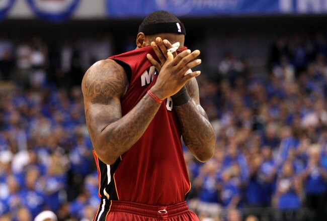 DALLAS, TX - JUNE 07:  LeBron James #6 of the Miami Heat wipes his face with his jersey against the Dallas Mavericks in Game Four of the 2011 NBA Finals at American Airlines Center on June 7, 2011 in Dallas, Texas. NOTE TO USER: User expressly acknowledges and agrees that, by downloading and/or using this Photograph, user is consenting to the terms and conditions of the Getty Images License Agreement  (Photo by Mike Ehrmann/Getty Images)