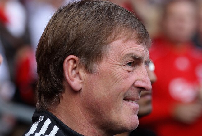 LIVERPOOL, ENGLAND - AUGUST 06:  Liverpool manager Kenny Dalglish with a sea of Liverpool fans scarfs behind him prior to the pre season friendly match between Liverpool and Valencia at Anfield on August 6, 2011 in Liverpool, England.  (Photo by Clive Brunskill/Getty Images)