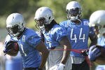 ALLEN PARK, MI - JULY 30: Aaron Brown #21 and Mikel Leshoure #25 go through the morning drills druing the Lions training camp on July 30, 2011 in Allen Park, Michigan.  (Photo by Leon Halip/Getty Images)