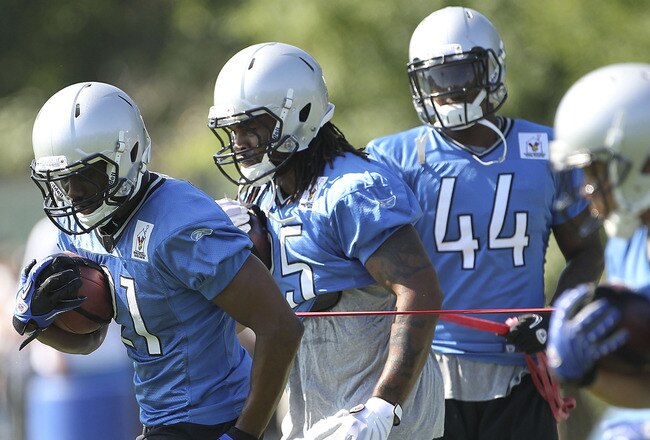 ALLEN PARK, MI - JULY 30: Aaron Brown #21 and Mikel Leshoure #25 go through the morning drills druing the Lions training camp on July 30, 2011 in Allen Park, Michigan.  (Photo by Leon Halip/Getty Images)