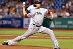 ST PETERSBURG, FL - JUNE 16:  Pitcher Clay Buchholz #11 of the Boston Red Sox pitches against the Tampa Bay Rays during the game at Tropicana Field on June 16, 2011 in St. Petersburg, Florida.  (Photo by J. Meric/Getty Images)