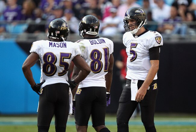 CHARLOTTE, NC - NOVEMBER 21:  Joe Flacco #5 of the Baltimore Ravens talks to his wide receivers Derrick Mason #85 and Anquan Boldin #81 during a timeout against the Carolina Panthers at Bank of America Stadium on November 21, 2010 in Charlotte, North Carolina.  (Photo by Streeter Lecka/Getty Images)