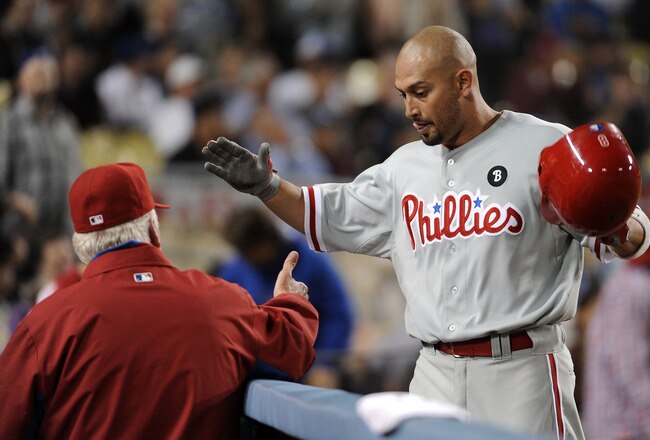 LOS ANGELES, CA - AUGUST 08:  Shane Victorino #8 of the Philadelphia Phillies celebrates his homerun with Manager Charlie Manual #41 for a 5-3 lead during the eighth inning at Dodger Stadium on August 8, 2011 in Los Angeles, California.  (Photo by Harry How/Getty Images)