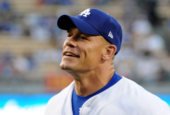 LOS ANGELES - AUGUST 20: WWE Superstar John Cena smiles after throwing out the first pitch before the game between the Chicago Cubs and the Los Angeles Dodgers at Dodger Stadium on August 20, 2009 in Los Angeles, California. (Photo by Harry How/Getty Images)