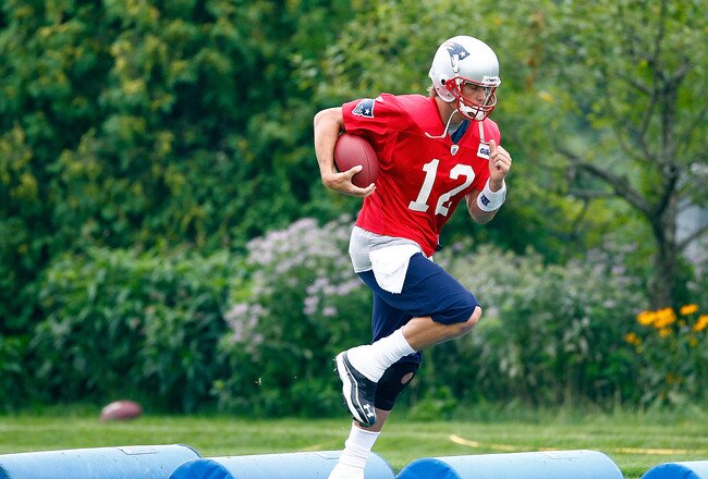 FOXBOROUGH, MA  - JULY 29:  Tom Brady #12 of the New England Patriots participates in training camp at Gillette Stadium on July 29, 2011 in Foxborough, Massachusetts.  (Photo by Jim Rogash/Getty Images)
