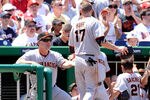 WASHINGTON - JULY 11:  Aubrey Huff #17 of the San Francisco Giants is congratulated by manager Bruce Bochy after scoring in the third inning against the Washington Nationals at Nationals Park on July 11, 2010 in Washington, DC.  (Photo by Greg Fiume/Getty Images)