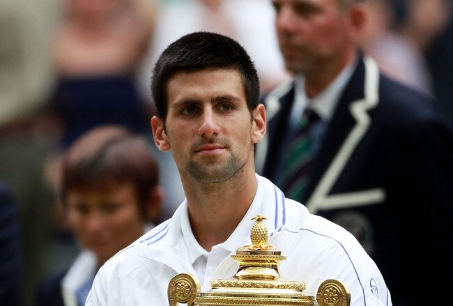 LONDON, ENGLAND - JULY 03:  Novak Djokovic of Serbia holds the championship trophy after winning his final round Gentlemen's match against Rafael Nadal of Spain on Day Thirteen of the Wimbledon Lawn Tennis Championships at the All England Lawn Tennis and Croquet Club on July 3, 2011 in London, England.  (Photo by Julian Finney/Getty Images)