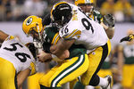 ARLINGTON, TX - FEBRUARY 06:  Aaron Rodgers #12 of the Green Bay Packers is sacked by Ziggy Hood #96 of the Pittsburgh Steelers during the fourth quarter of Super Bowl XLV at Cowboys Stadium on February 6, 2011 in Arlington, Texas.  (Photo by Ronald Martinez/Getty Images)