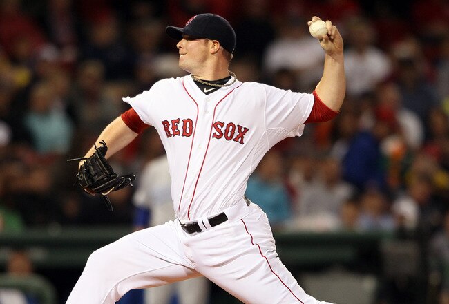 BOSTON, MA - JULY 25:  Jon Lester #31 of the Boston Red Sox delivers a pitch in the first inning against the Kansas City Royals on July 25, 2011 at Fenway Park in Boston, Massachusetts.  (Photo by Elsa/Getty Images)