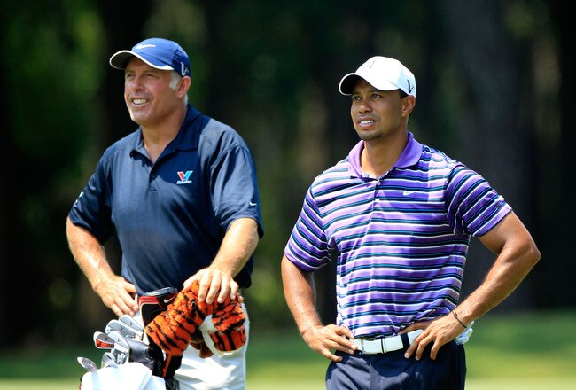 PONTE VEDRA BEACH, FL - MAY 10:  Tiger Woods (R) and caddie Steve Williams look on during a practice round prior to the start of THE PLAYERS Championship held at THE PLAYERS Stadium course at TPC Sawgrass on May 10, 2011 in Ponte Vedra Beach, Florida.  (Photo by Sam Greenwood/Getty Images)