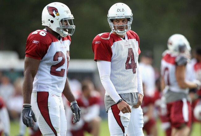 FLAGSTAFF, AZ - AUGUST 04:  Quarterback Kevin Kolb #4 of the Arizona Cardinals talks with runningback Beanie Wells #26 during the team training camp at Northern Arizona University on August 4, 2011 in Flagstaff, Arizona.  (Photo by Christian Petersen/Getty Images)