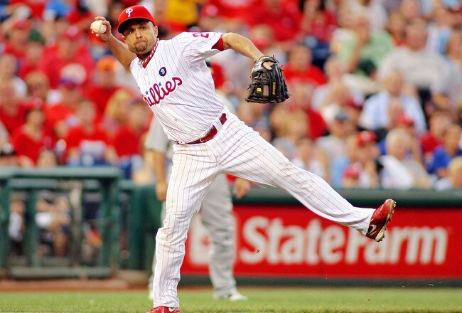 PHILADELPHIA - JUNE 24: Placido Polanco #27 of the Philadelphia Phillies throws the ball toward first base against the Oakland Athletics at Citizens Bank Park on June 24, 2011 in Philadelphia, Pennsylvania.  (Photo by Len Redkoles/Getty Images)
