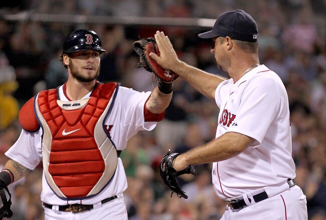 BOSTON, MA - AUGUST 3:  Tim Wakefield #49 of the Boston Red Sox celebrates with Jarrod Saltalamacchia #39 of the Boston Red Sox, who threw out a runner attempting to steal, during a game against the Cleveland Indians at Fenway Park on August 3, 2011 in Boston, Massachusetts.  Wakefield is attempting to earnhis 200 win with the Red Sox. (Photo by Jim Rogash/Getty Images)