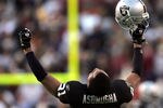 WASHINGTON - NOVEMBER 20:  Oakland Raiders cornerback Nnamdi Asomugha #21 celebrates after the Raiders recovered a game winning fumble in the fourth quarter on November 20, 2005 at Fed Ex Field in Landover, Maryland.  (Photo by Win McNamee/Getty Images)