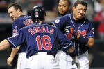 CLEVELAND, OH - AUGUST 10: Jason Donald #16 celebrates with Kosuke Fukudome #1 of the Cleveland Indians after Fukadome was hit by a pitch with the bases loaded to score the winning run to defeat the Detroit Tigers 3-2 in the fourteenth inning at Progressive Field on August 10, 2011 in Cleveland, Ohio. (Photo by Jason Miller/Getty Images)