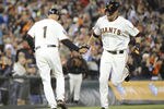 SAN FRANCISCO, CA - AUGUST 9: Aubrey Huff #17 of the San Francisco Giants rounds the bases and shakes hands with Tim Flannery #1 after hitting a home run off of James McDonald #53 of the Pittsburgh Pirates in the six inning during an MLB baseball game at AT&T Park August 9, 2011 in San Francisco, California. (Photo by Thearon W. Henderson/Getty Images)