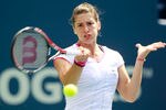 TORONTO, ON - AUGUST 09:  Andrea Petkovic of Germany returns to Eugenie Bouchard of Canada on Day 2 of the Rogers Cup presented by National Bank at the Rexall Centre on August 9, 2011 in Toronto, Ontario, Canada.  (Photo by Chris Trotman/Getty Images)