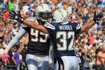 SAN DIEGO - OCTOBER 03:  Eric Weddle #32 of the San Diego Chargers congratulates teammate Shaun Phillips #95 after intercepting a pass for a touchdown in the second quarter against the Arizona Cardinals at Qualcomm Stadium on October 3, 2010 in San Diego, California.  (Photo by Jeff Gross/Getty Images)