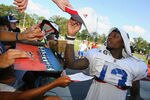 PITTSFORD, NY - AUGUST 08:  Stevie Johnson #13  of the Buffalo Bills signs autographs during the Buffalo Bills Training Camp at St. John Fisher College on August 8, 2011 in Pittsford, New York.  (Photo by Rick Stewart/Getty Images)