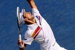 MONTREAL, QC - AUGUST 10:  Novak Djokovic of Serbia serves to Nikolay Davydenko of Russia during the Rogers Cup at Uniprix Stadium on August 10, 2011 in Montreal, Canada.  (Photo by Matthew Stockman/Getty Images)