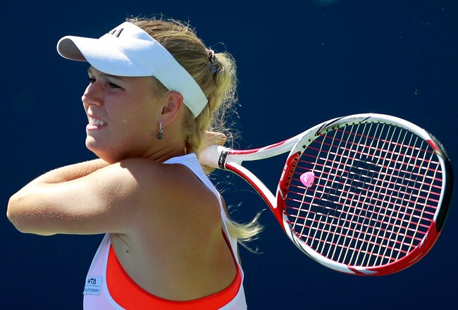 TORONTO, ON - AUGUST 10:  Caroline Wozniacki of Denmark returns to Roberta Vinci of Italy on Day 3 of the Rogers Cup presented by National Bank at the Rexall Centre on August 10, 2011 in Toronto, Ontario, Canada.  (Photo by Chris Trotman/Getty Images)