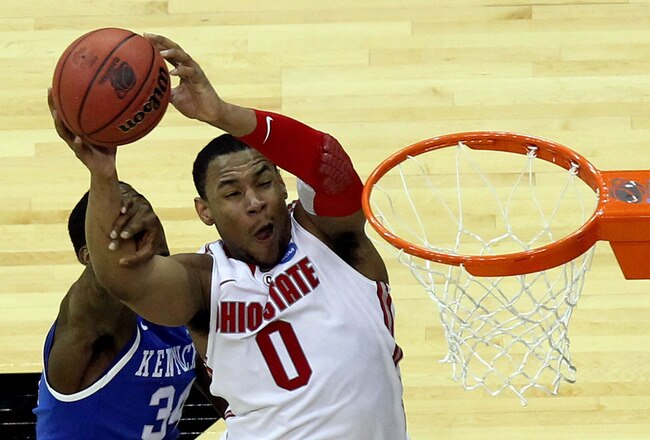 NEWARK, NJ - MARCH 25:  Jared Sullinger #0 of the Ohio State Buckeyes goes for a lay up against DeAndre Liggins #34 of the Kentucky Wildcats during the second half of the east regional semifinal of the 2011 NCAA Men's Basketball Tournament at the Prudential Center on March 25, 2011 in Newark, New Jersey.  (Photo by Nick Laham/Getty Images)
