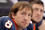 DENVER - OCTOBER 24:  Quarterbacks Kyle Orton #8 and Tim Tebow #15 of the Denver Broncos look on from the bench during their 59-14 loss to the Oakland Raiders at INVESCO Field at Mile High on October 24, 2010 in Denver, Colorado. (Photo by Justin Edmonds/Getty Images)