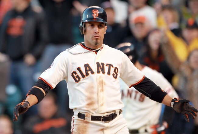 SAN FRANCISCO, CA - JUNE 12:  Andres Torres #56 of the San Francisco Giants walks back to the dugout after he scored to put the Giants ahead 4-2 in the seventh inning against the Cincinnati Reds at AT&T Park on June 12, 2011 in San Francisco, California.  (Photo by Ezra Shaw/Getty Images)