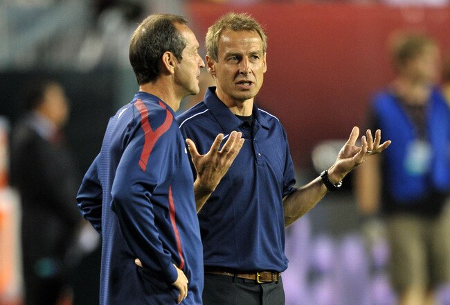 PHILADELPHIA, PA - AUGUST 10: Head coach Jurgen Klinsmann of the United States talks with former player Thomas Dooley before the game against  Mexico at Lincoln Financial Field on August 10, 2011 in Philadelphia, Pennsylvania. (Photo by Drew Hallowell/Getty Images)