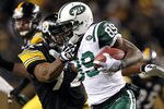PITTSBURGH, PA - JANUARY 23:  Jerricho Cotchery #89 of the New York Jets runs with the ball against James Harrison #92 of the Pittsburgh Steelers during the 2011 AFC Championship game at Heinz Field on January 23, 2011 in Pittsburgh, Pennsylvania.  (Photo by Al Bello/Getty Images)