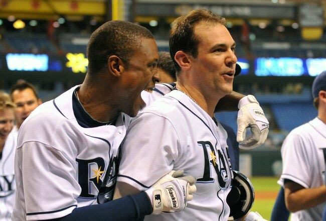 ST. PETERSBURG, FL - AUGUST 8:  Outfielder Desmond Jennings #8  of the Tampa Bay Rays hugs infielder Casey Kotchman #11 against the Kansas City Royals August 8, 2011 at Tropicana Field in St. Petersburg, Florida. Kotchman homered in the ninth inning and the Rays won 2 - 1. (Photo by Al Messerschmidt/Getty Images)