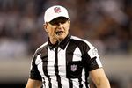 ARLINGTON, TX - JANUARY 9:  Referee Ed Hochuli during a game between the Philadelphia Eagles and the Dallas Cowboys during the 2010 NFC wild-card playoff game at Cowboys Stadium on January 9, 2010 in Arlington, Texas. (Photo by Ronald Martinez/Getty Images)