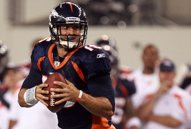 ARLINGTON, TX - AUGUST 11:  Tim Tebow #15 of the Denver Broncos drops back to pass against the Dallas Cowboys during a preseason game at Cowboys Stadium on August 11, 2011 in Arlington, Texas.  (Photo by Ronald Martinez/Getty Images)