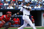 NEW YORK, NY - AUGUST 11: Robinson Cano #24 of the New York Yankees watches the ball after hitting a grand slam home run in the seventh inning against Los Angeles Angels of Anaheim at Yankee Stadium on August 11, 2011 in the Bronx borough of New York City. (Photo by Andy Marlin/Getty Images)