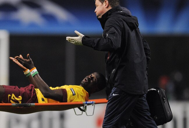 BRAGA, PORTUGAL - NOVEMBER 23:  Emmanuel Eboue of Arsenal reacts on a stretcher during the UEFA Champions League Group H match between SC Braga and Arsenal at Estadio Municipal de Braga on November 23, 2010 in Braga, Portugal. SC Braga won the match 2-0.  (Photo by David Ramos/Getty Images)
