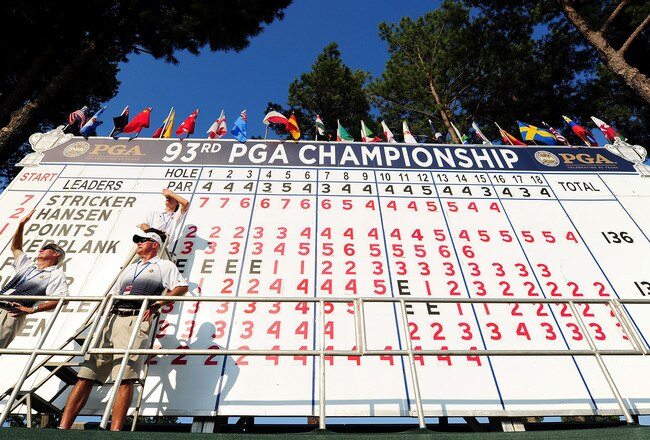 JOHNS CREEK, GA - AUGUST 12:  Volunteers watch play on the 18th hole in front of the leader board during the second round of the 93rd PGA Championship at the Atlanta Athletic Club on August 12, 2011 in Johns Creek, Georgia.  (Photo by Stuart Franklin/Getty Images)