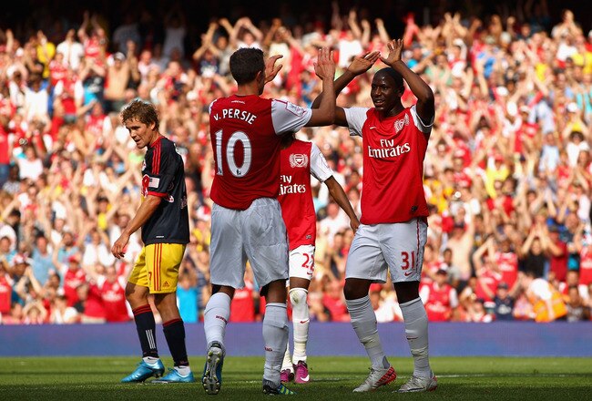 LONDON, ENGLAND - JULY 31:  Robin van Persie of Arsenal celebrates after scoring the opening goal with team mate Benik Afobe during the Emirates Cup match between Arsenal and New York Red Bulls at the Emirates Stadium on July 31, 2011 in London, England.  (Photo by Richard Heathcote/Getty Images)
