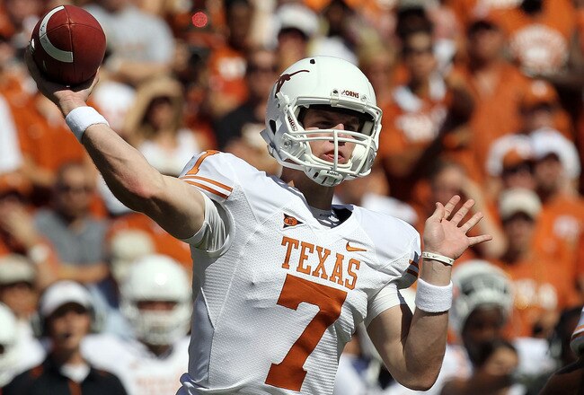 DALLAS - OCTOBER 02:  Quarterback Garrett Gilbert #7 of the Texas Longhorns drops back to pass against the Oklahoma Sooners in the second quarter at the Cotton Bowl on October 2, 2010 in Dallas, Texas.  (Photo by Ronald Martinez/Getty Images)