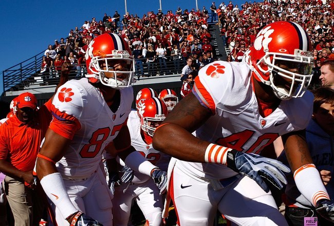COLUMBIA, SC - NOVEMBER 28:  Andre Branch #40 and members of the Clemson Tigers run onto the field prior to the start of the game against the South Carolina Gamecocks at Williams-Brice Stadium on November 28, 2009 in Columbia, South  Carolina.  (Photo by Scott Halleran/Getty Images)