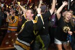 BOSTON, MA - JUNE 15:  Fans of the Boston Bruins react to a goal at Hurricane O'Reilly's Bar during Game Seven of the 2011 Stanley Cup Final against the Vancouver Canucks on June 15, 2011 in Boston, Massachusetts. (Photo by Jim Rogash/Getty Images)